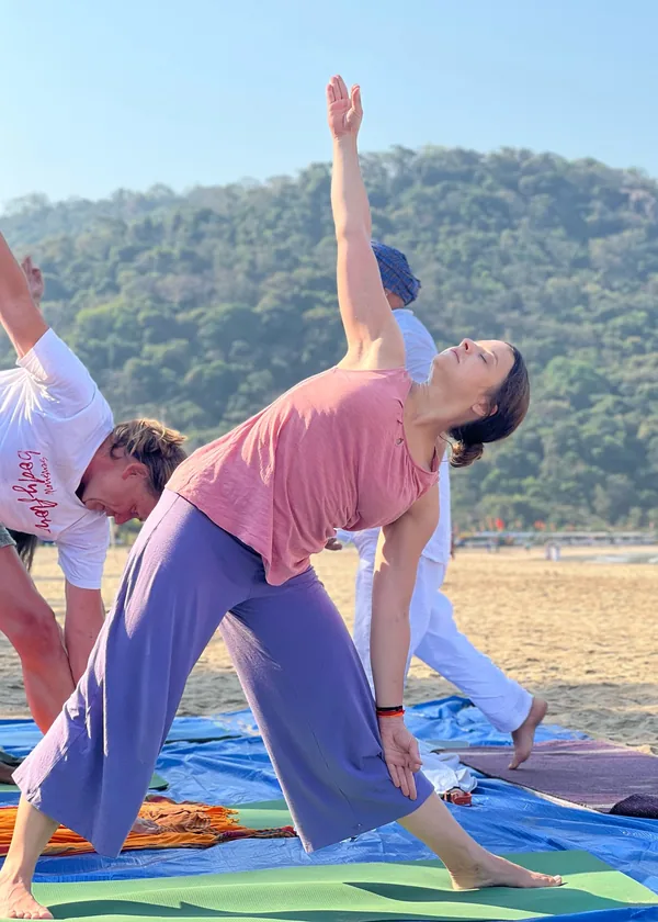 Students practising yoga asana at Purnam YogaShala, Agonda Beach Goa