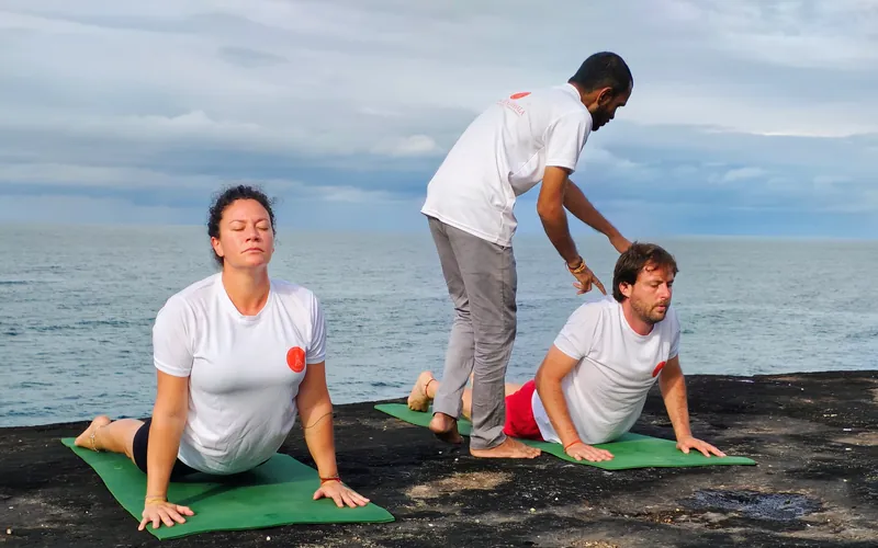 Yoga teacher adjustment Agonda Beach — 200 hour yoga teacher training South Goa Purnam Yogashala