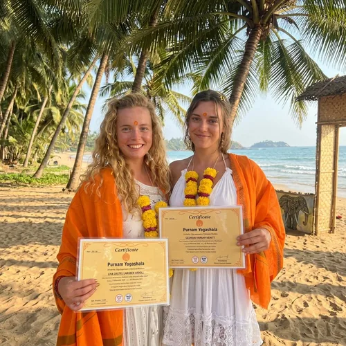 Purnam YogaShala graduates holding certificates on Agonda Beach Goa
